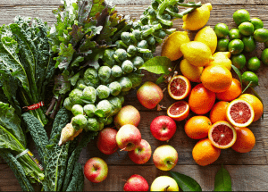 a group of fruits and vegetables on a wood surface Healthy Weight Loss Diets Kingswinford